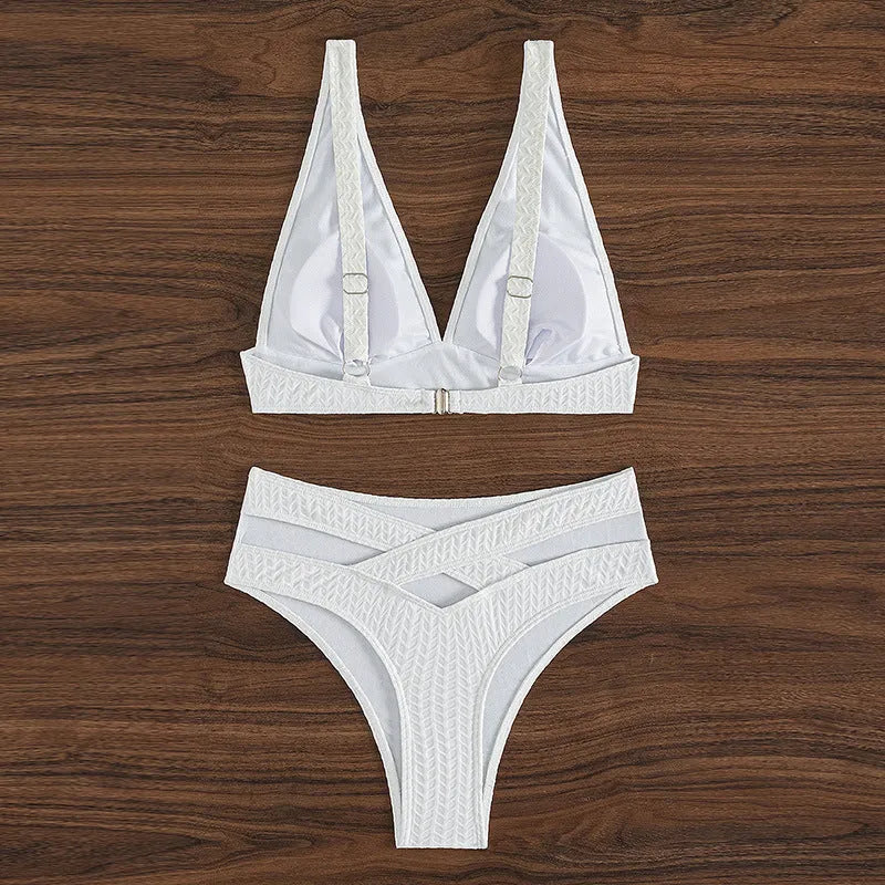 White backless bikini swimsuit with briefs bottom on a mannequin.