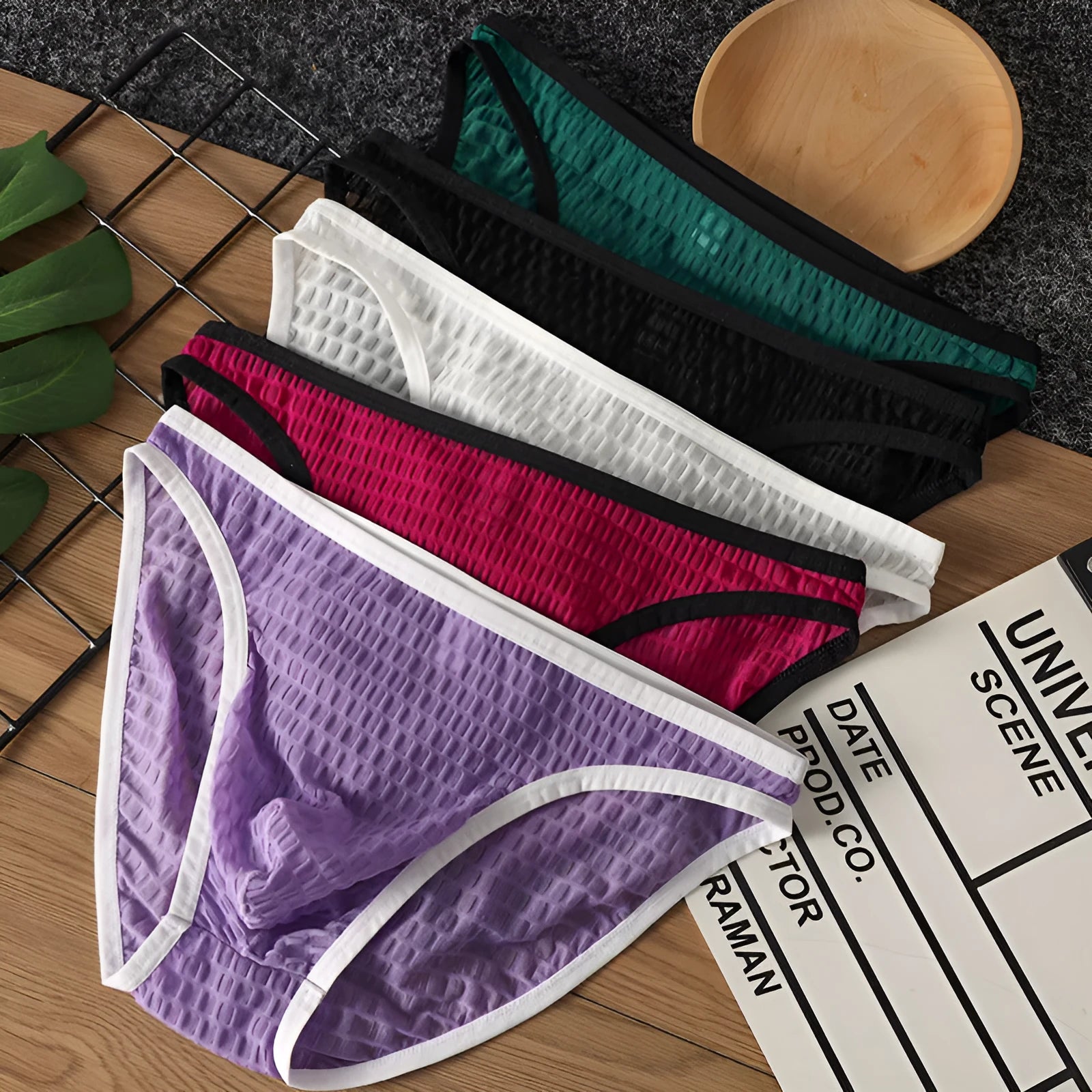 Men's low waist transparent visual lace underwear in multiple colours on a size chart