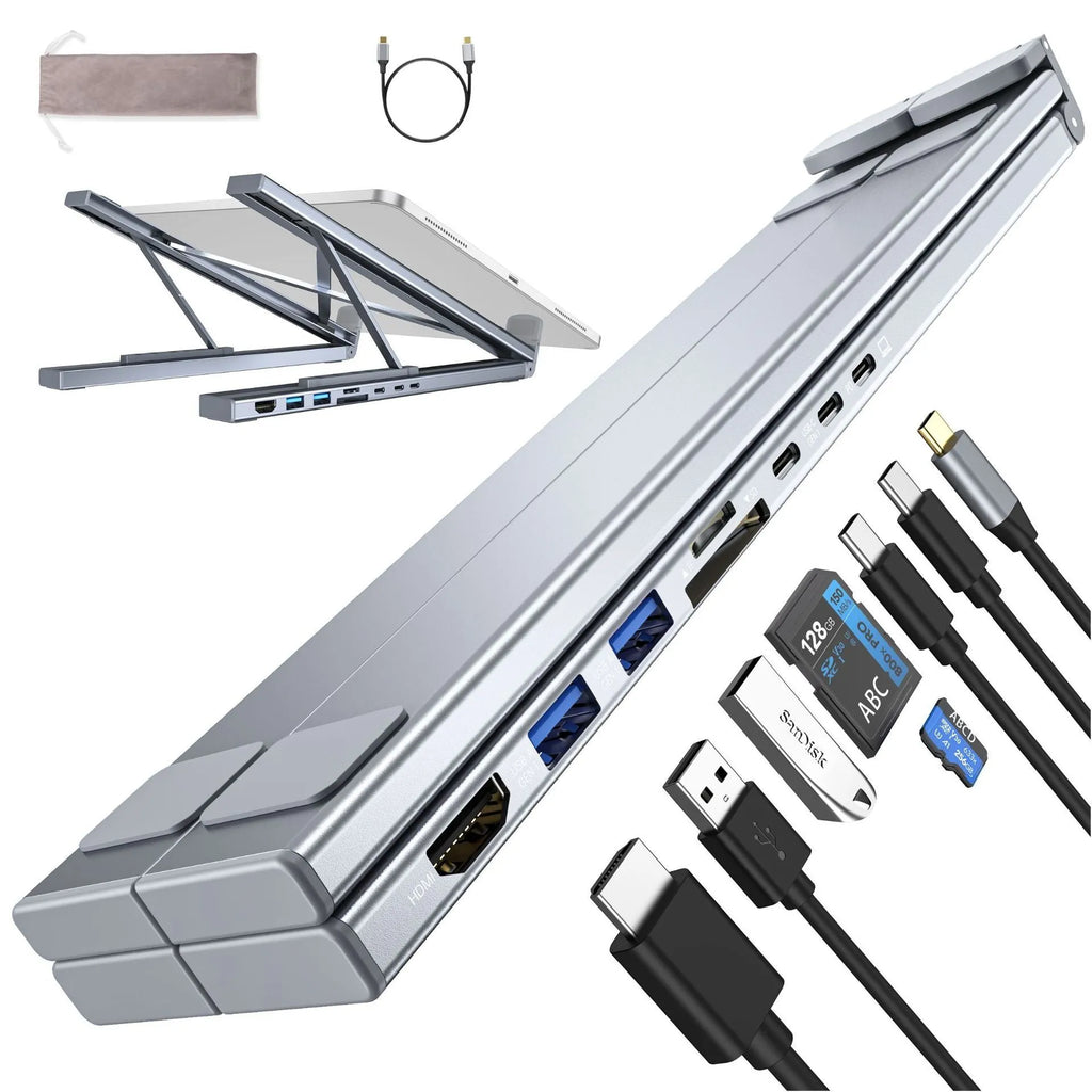 Aluminium folding laptop stand with integrated 8-in-1 docking hub ports and a short cable.