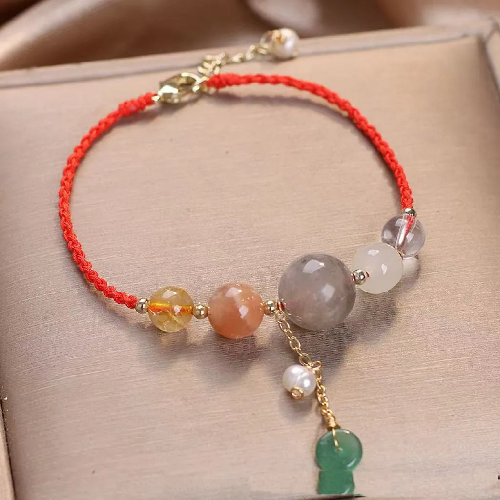 Hand-woven women's crystal bracelet with peace buckle clasp and sequin accents