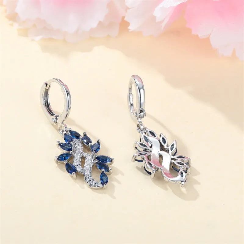 Women's alloy drop earrings with blue crystal stones in a platinum sapphire blue colour
