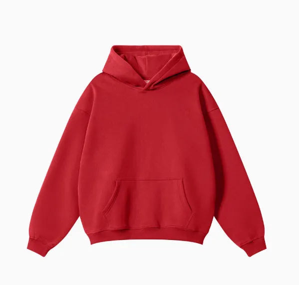 A loose-fitting men's cotton hooded sweater in a pullover style on a hanger.