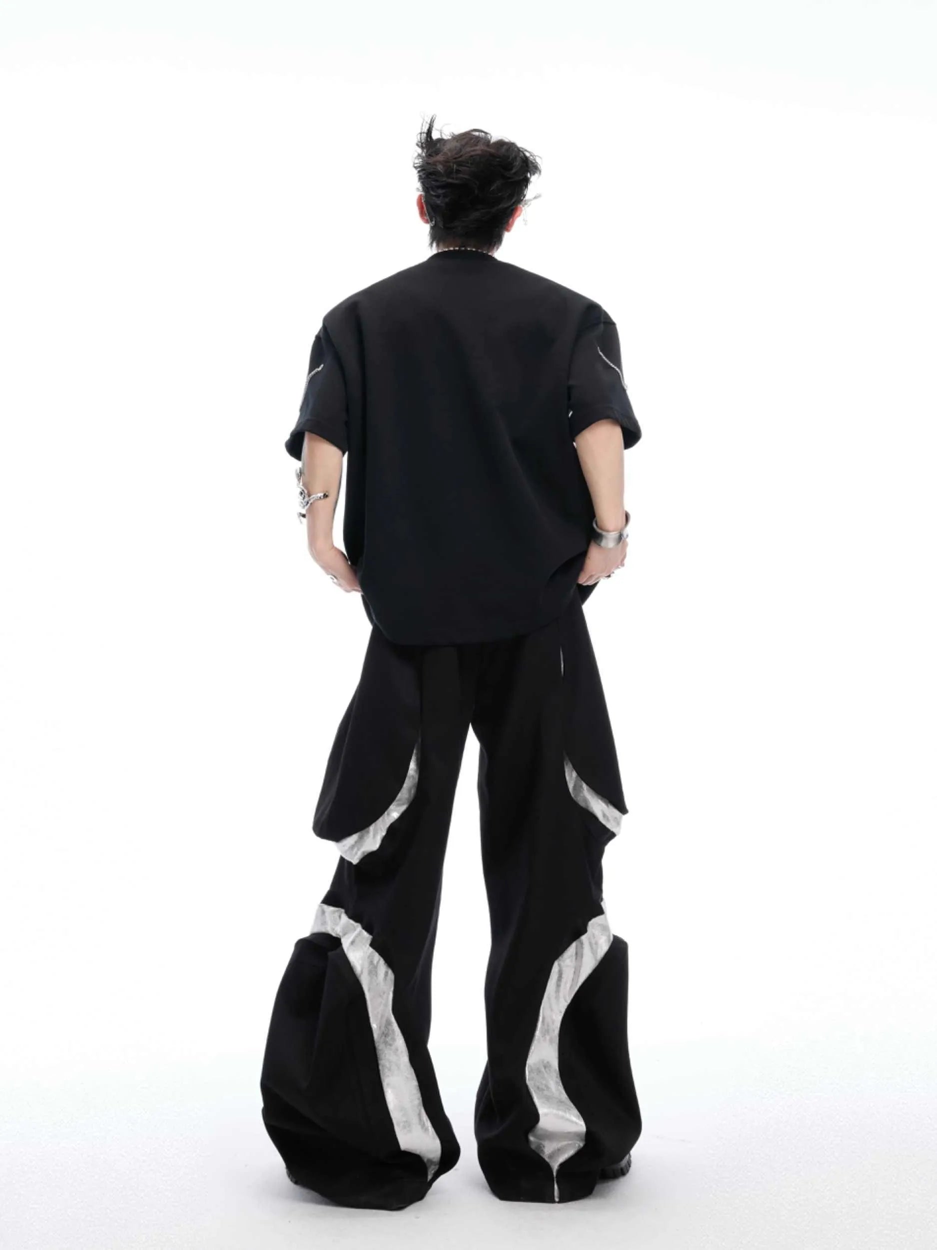Black heavy cotton t-shirt with padded shoulder panels and silver metal chain decorative details