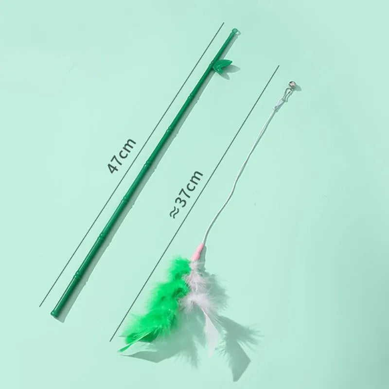 Green interactive cat feather wand toy with bell attachment on a durable stick