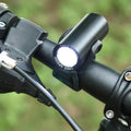 Black USB rechargeable bicycle front light with 350 lumen output and adjustable strap mount