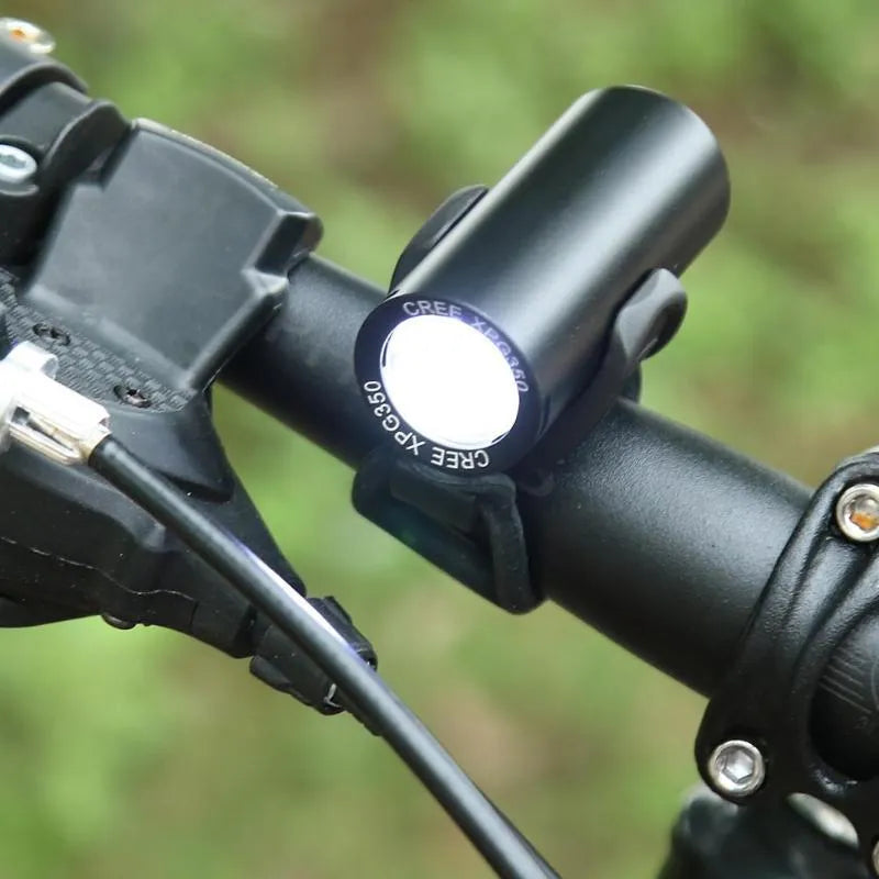 Black USB rechargeable bicycle front light with 350 lumen output and adjustable strap mount