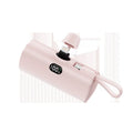 Capsule shaped digital display wireless power bank in multiple colours showing its compact size and built-in plug.