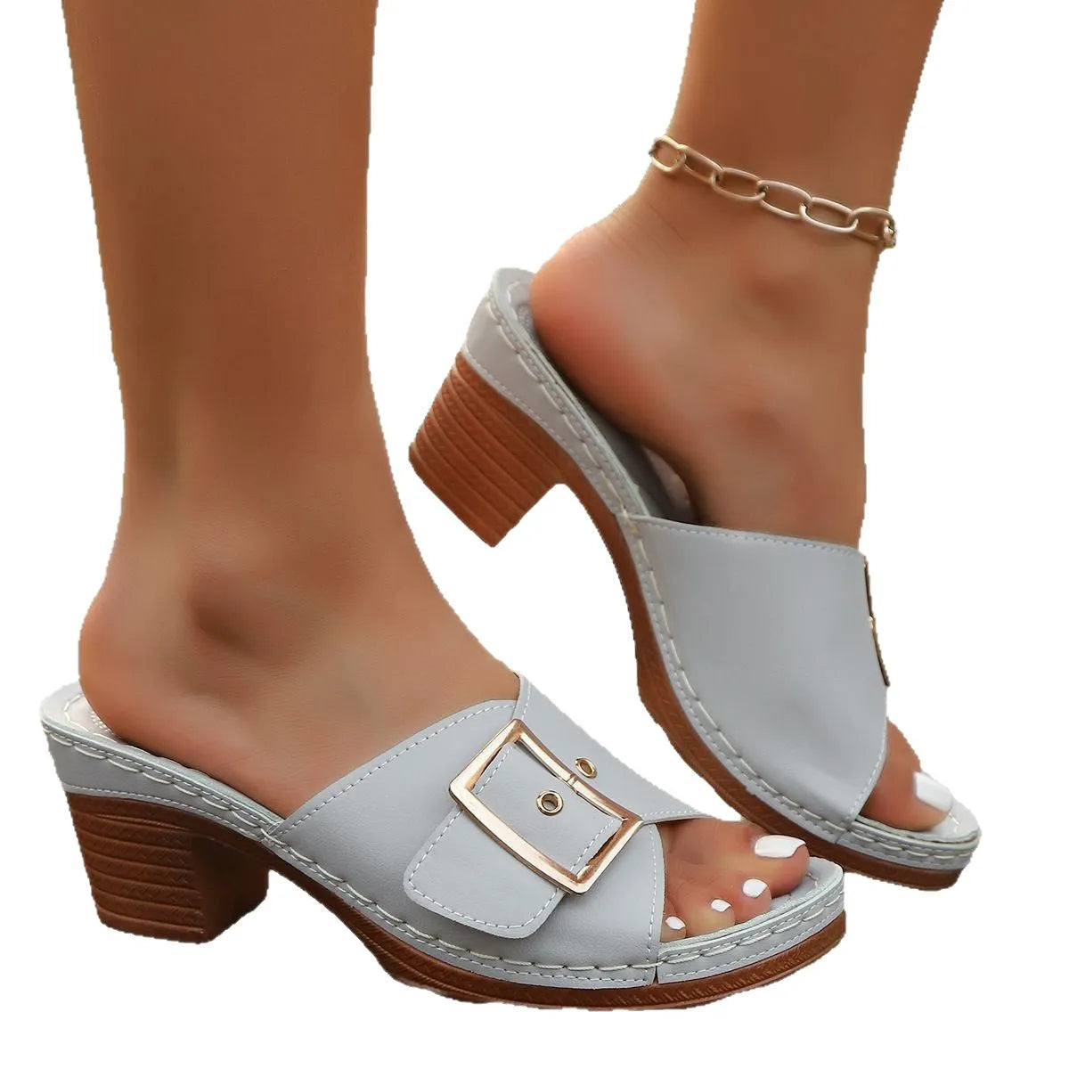 Women's black retro chunky heel slippers with a metal buckle and rubber sole.