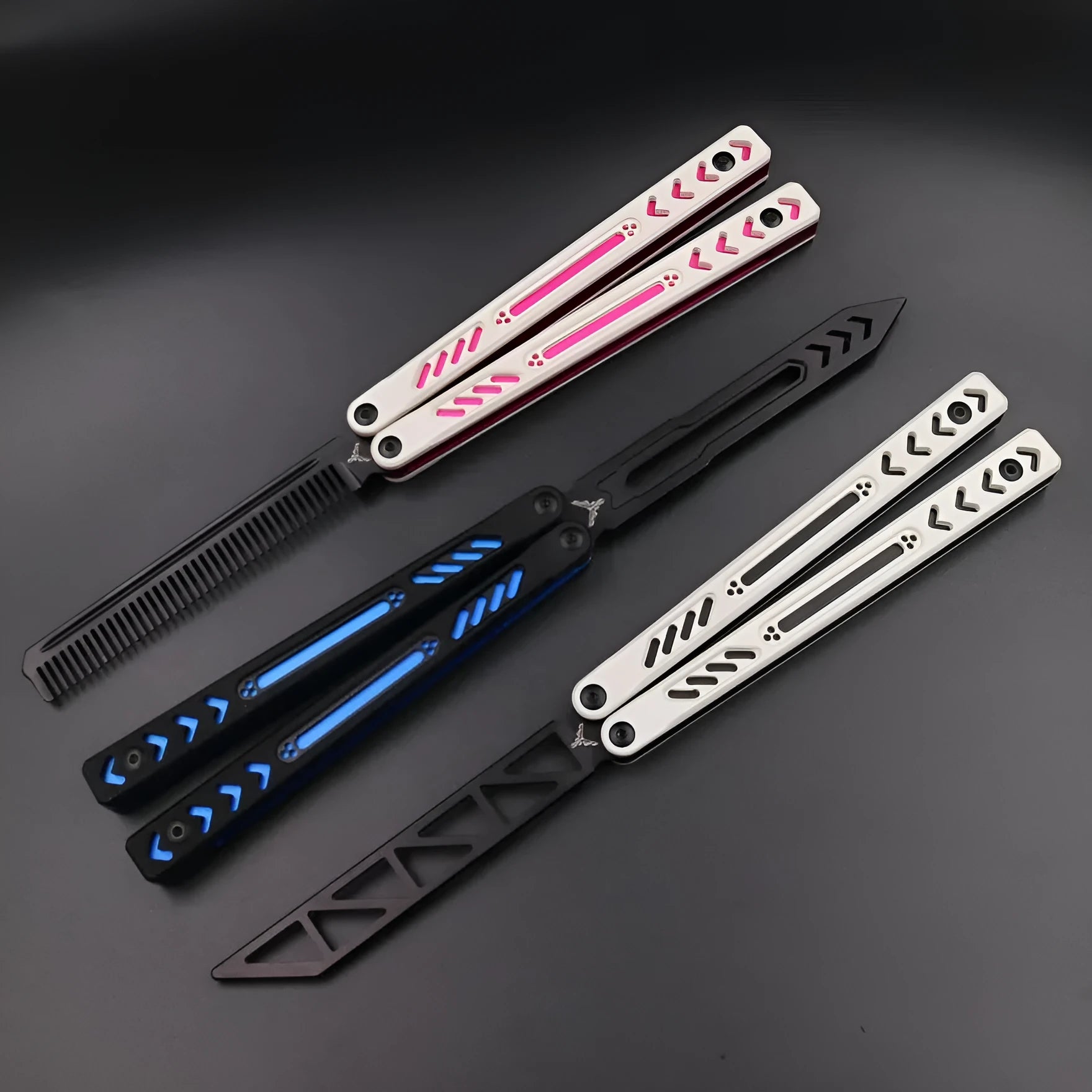 Aluminium handle unbladed butterfly knife trainer with black G10 grip patches on a blue background.