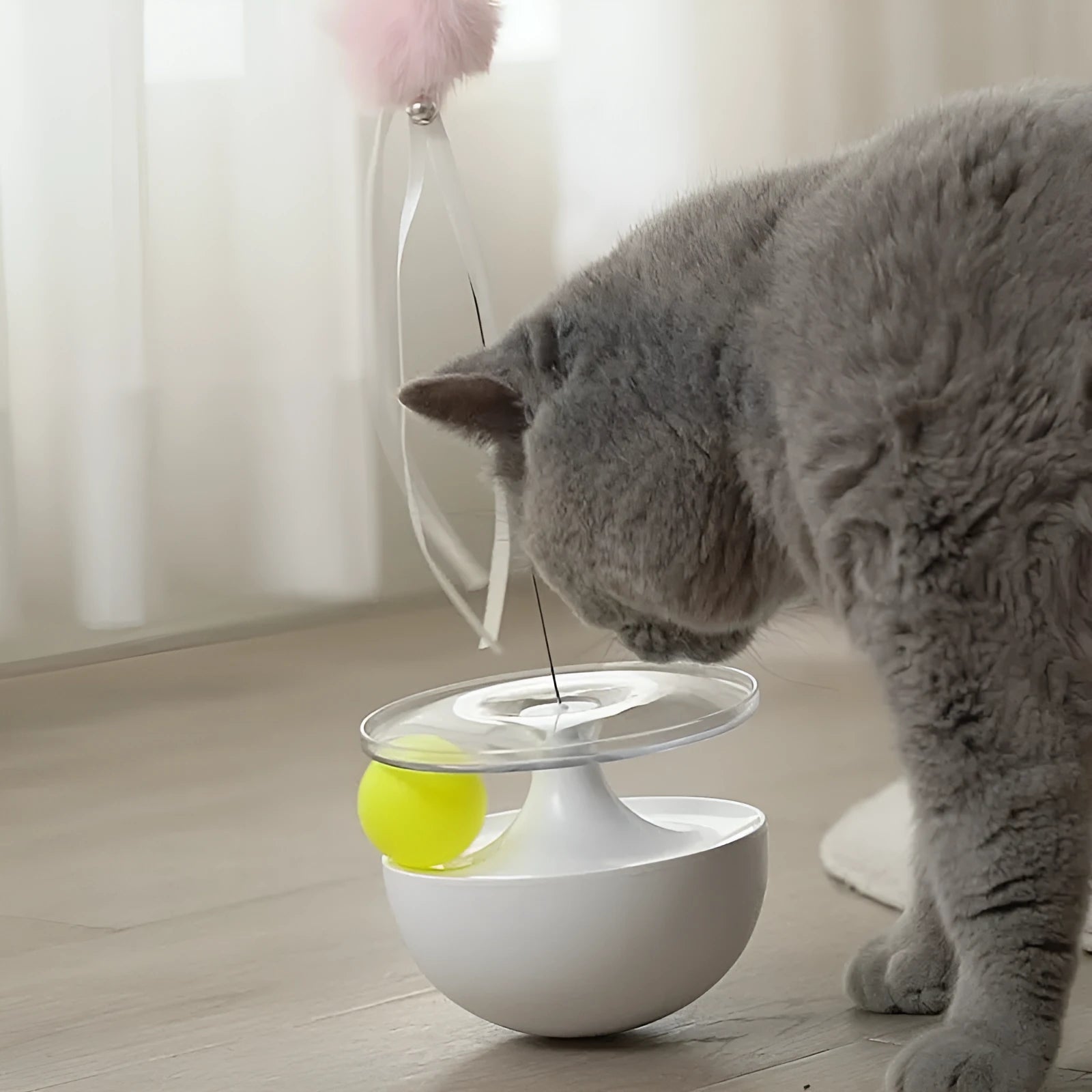 Self-congratulating stick tumbler cat toy in white HIPS+PC plastic on floor