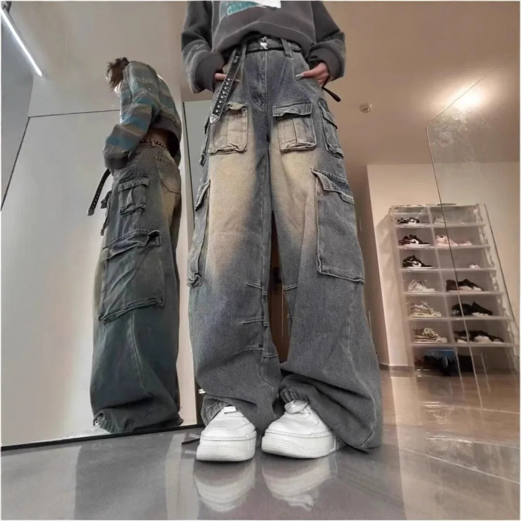 Man wearing loose light blue distressed jeans with multiple pockets, showcasing the straight-leg and utility style.