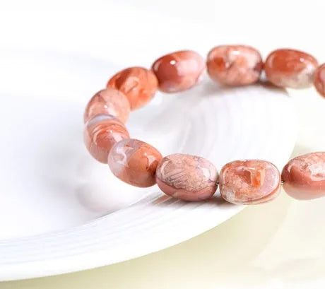 Natural cherry agate bracelet with 10x14mm barrel beads in geometric design