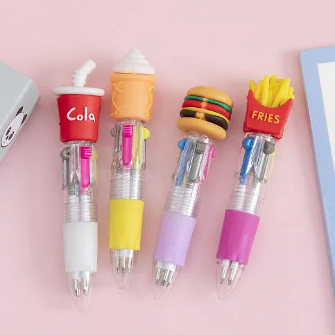 A press-action ballpoint pen with a four-colour cartridge, showing one of five random cartoon designs on the barrel.