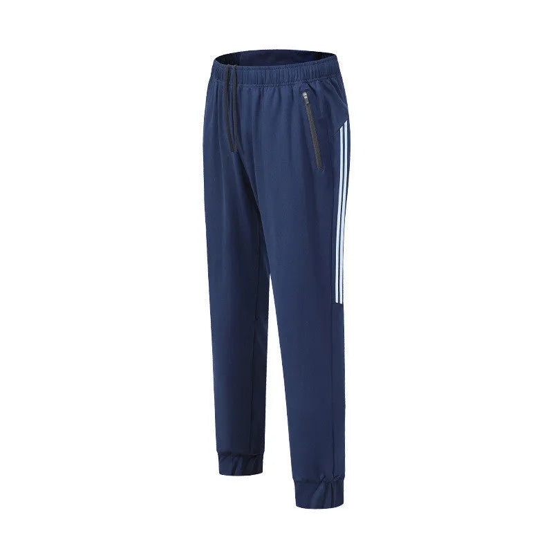 Men's black breathable polyester running trousers with mid-waist fit on a plain background.