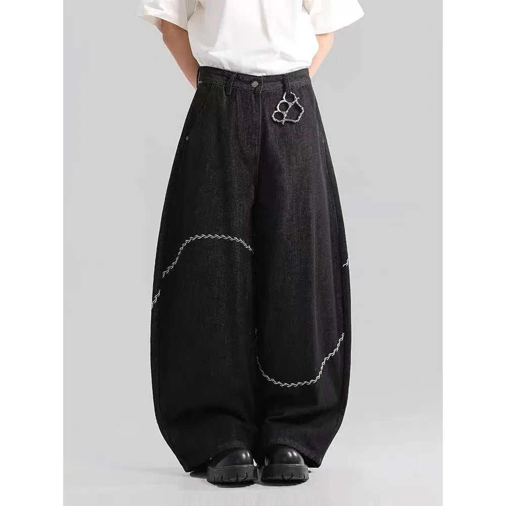 Black straight leg denim trousers with micro elastic waistband and zip fly placket detail