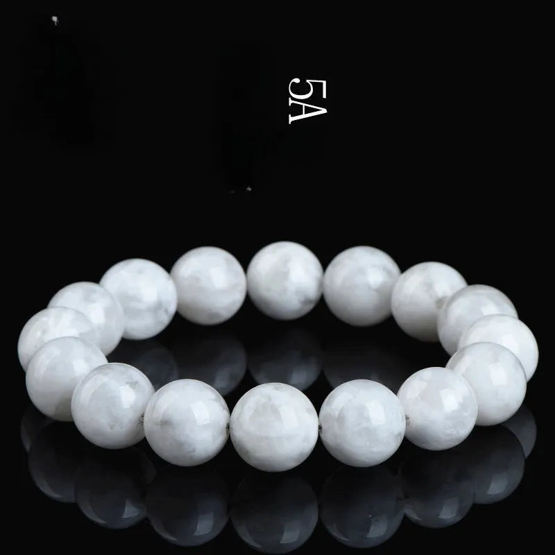 Close-up of a clear crystal blizzard snowflake bead bracelet with Ruyi and Xiangyun design elements.