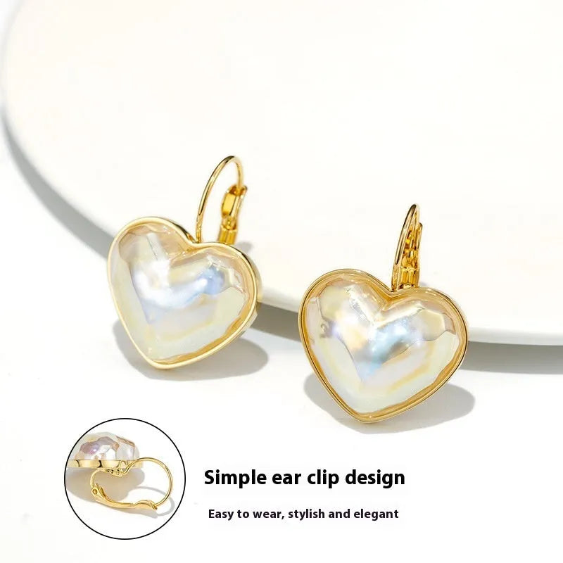 A pair of gold coloured alloy clip-on ear clip earrings for women.