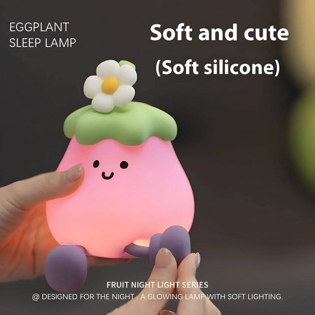 Cartoon eggplant small night lamp with soft yellow light beside broccoli design night light