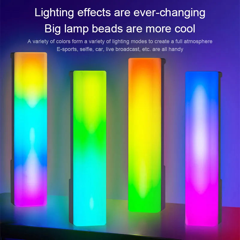 3D RGB music rhythm table lamp with voice control in black or white shell on a desk.