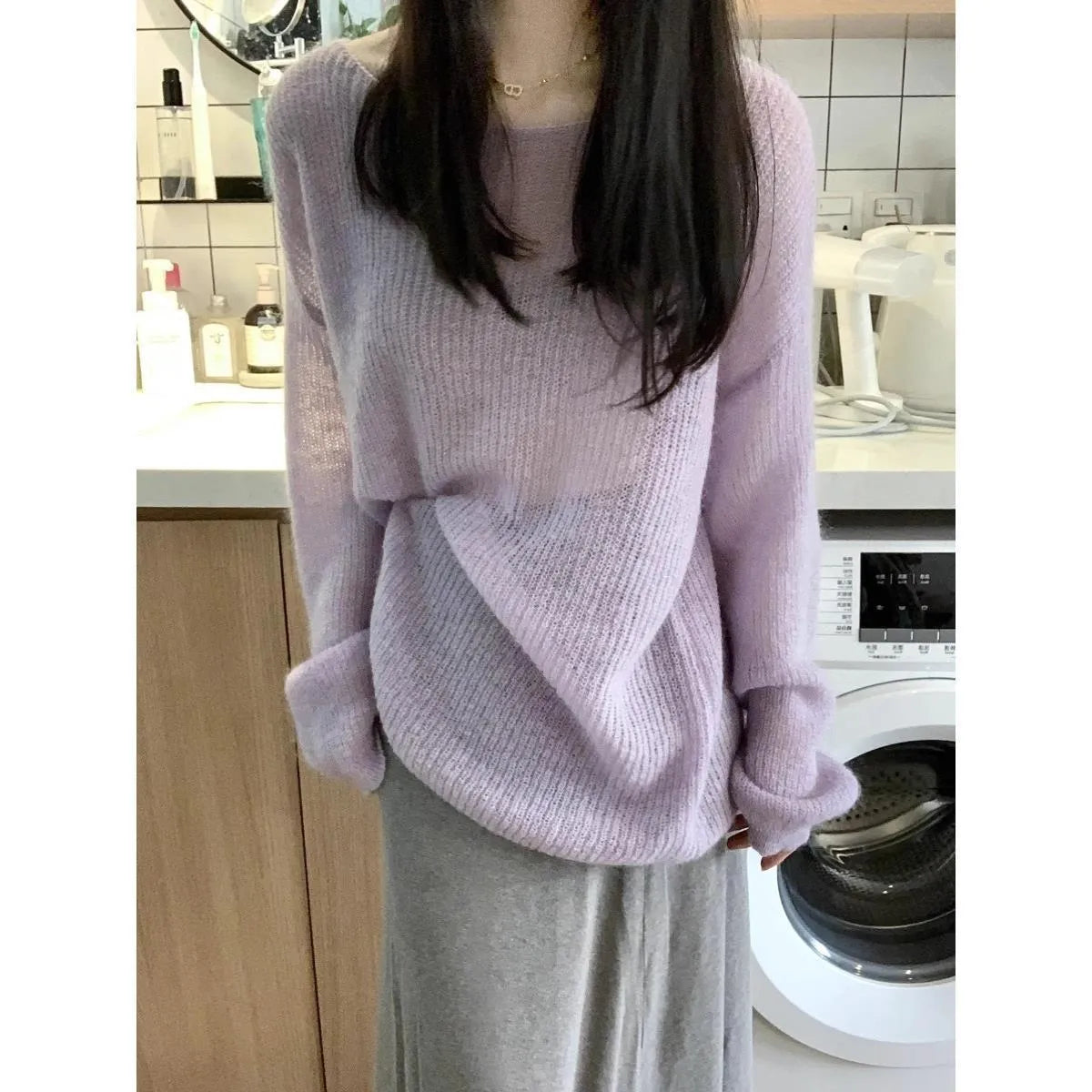 Purple sleeveless women's blouse with hollow out detail and round neck, made from ice silk fabric.