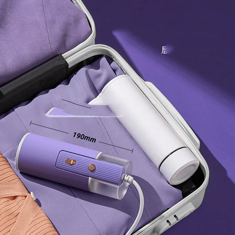 Portable handheld garment steamer in foldable design with purple colour option