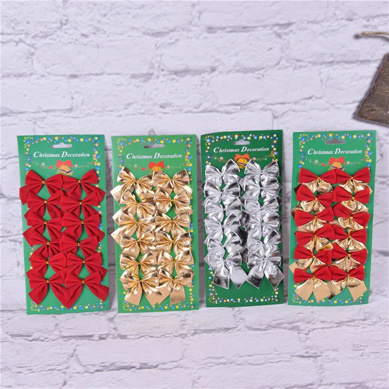 Red, gold, red gold, and silver 5 cm polyester Christmas bow ornaments on a green tree branch.