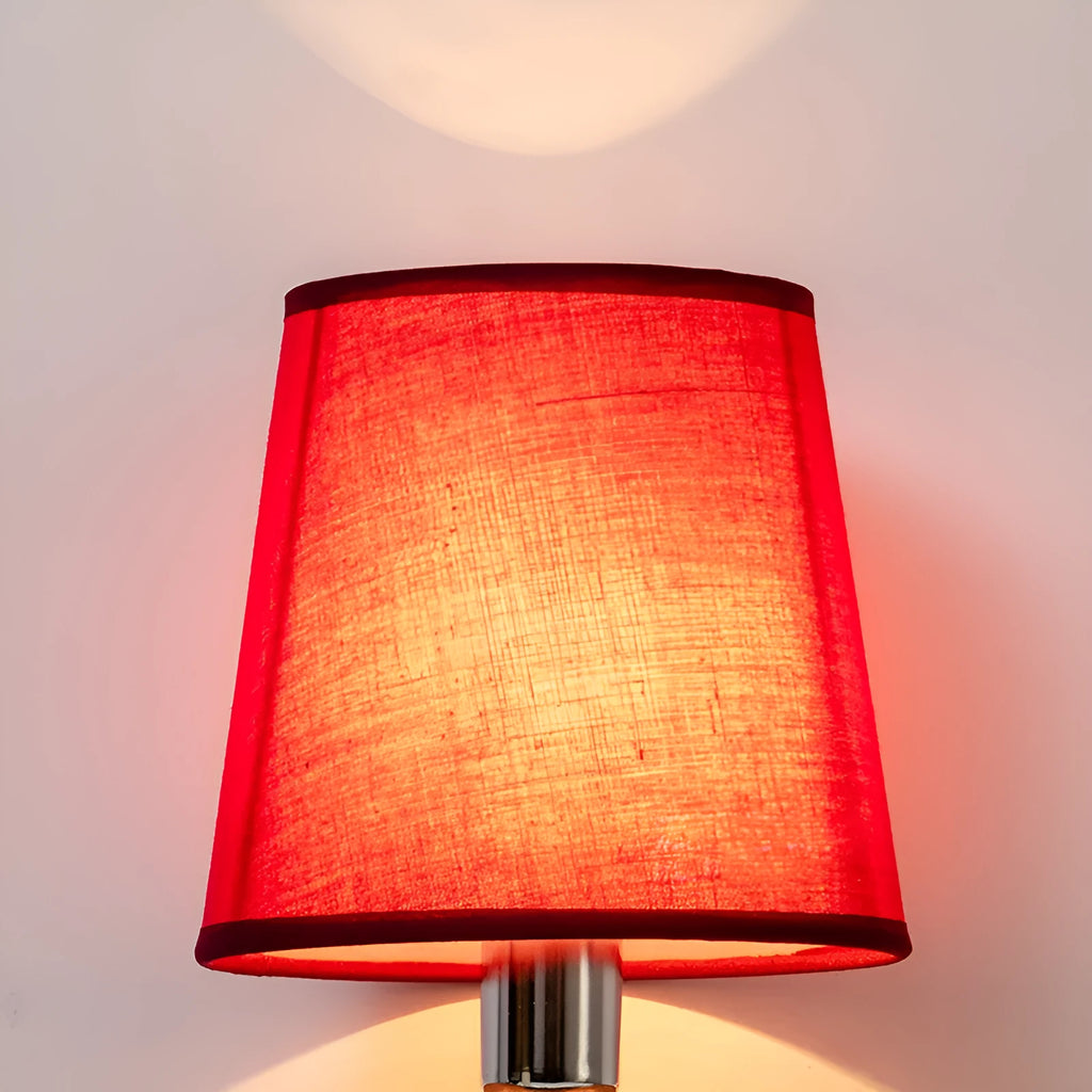 Modern minimalist fabric lampshade in a grey colour on a table lamp base.
