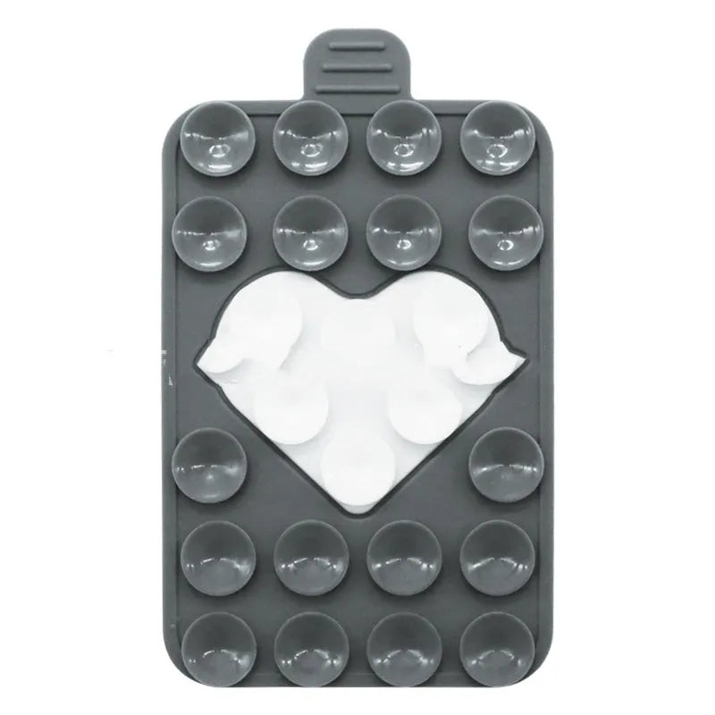 Double sided silicone suction cup phone case holder in gray white, showing hot pressed construction for universal fit on smooth surfaces