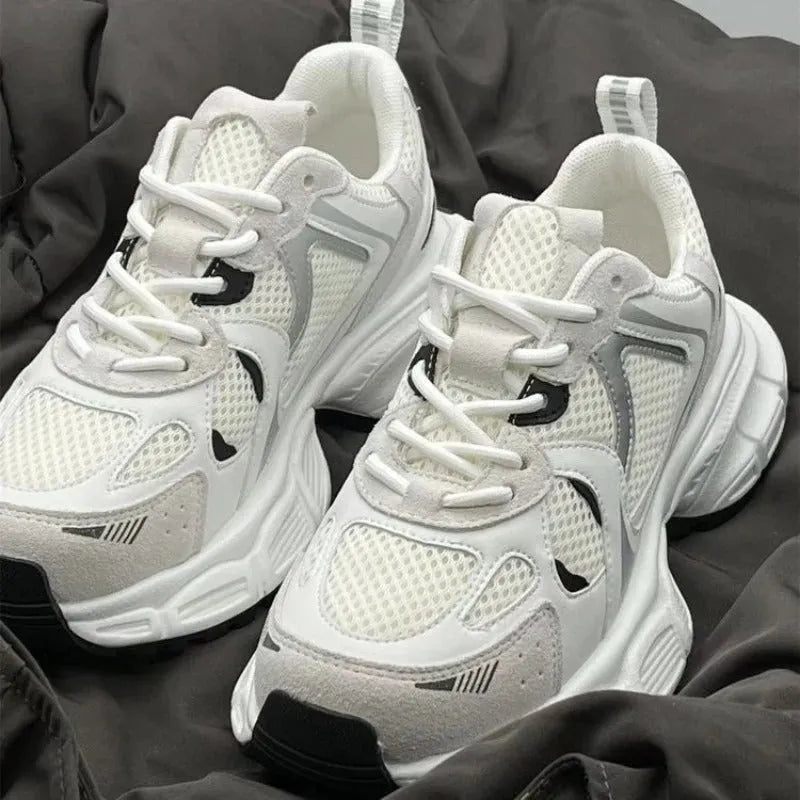 Beige Polar Wave mesh platform shoes with wedge heel and lace-up front on a rubber sole.