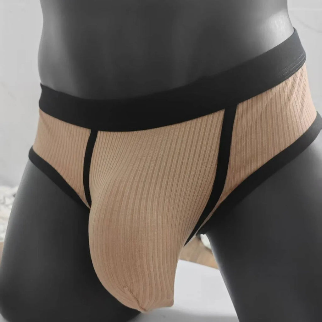 Men's solid colour U-shaped briefs in viscose fabric on a size chart background.