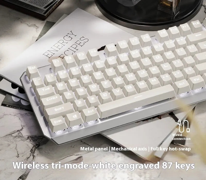 87-key wired mechanical keyboard with side-engraved keycaps, silver white finish, compact layout