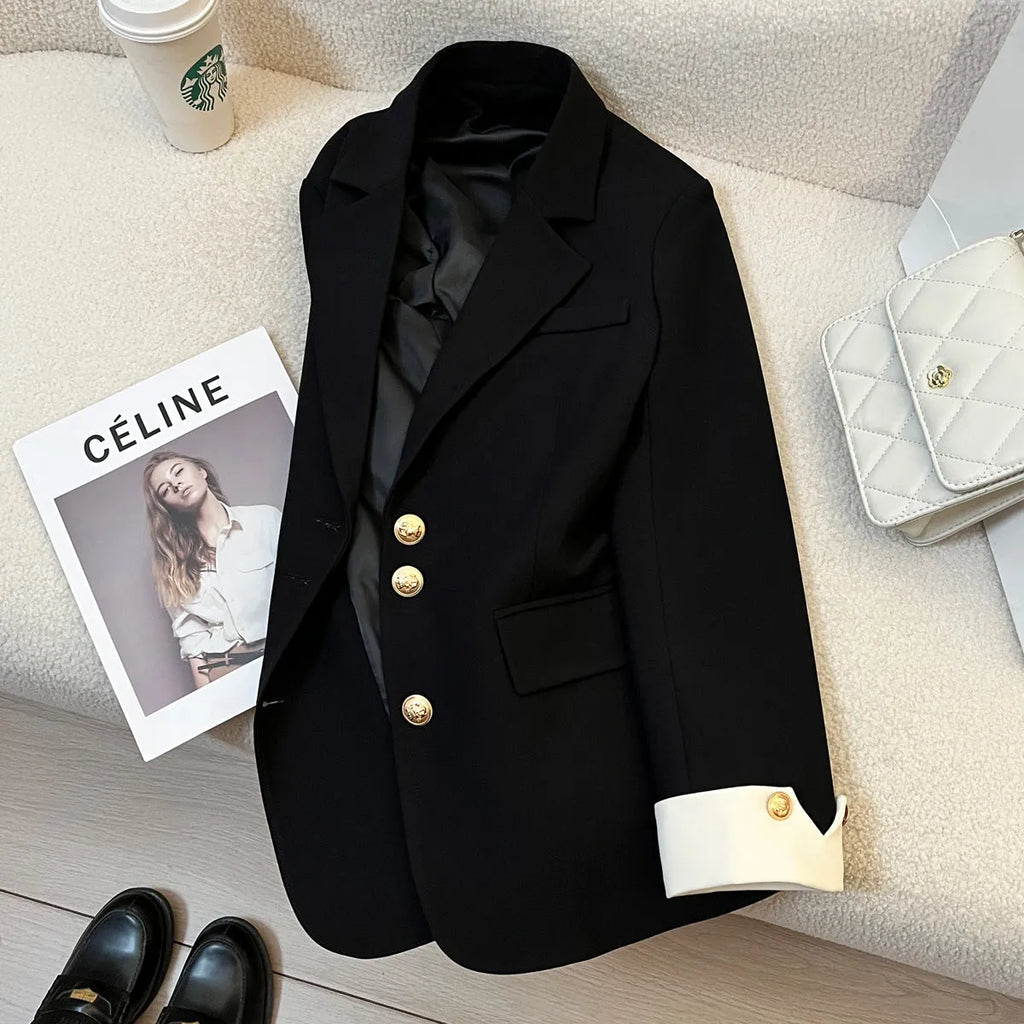 Women's loose fit Korean style coat in milky white, showing long sleeves and pockets.