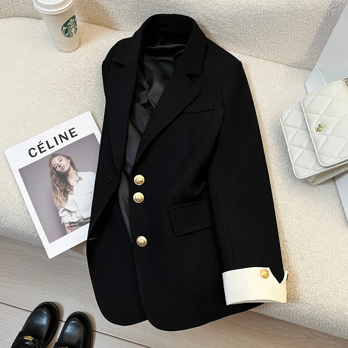 Women's loose fit Korean style coat in milky white, showing long sleeves and pockets.