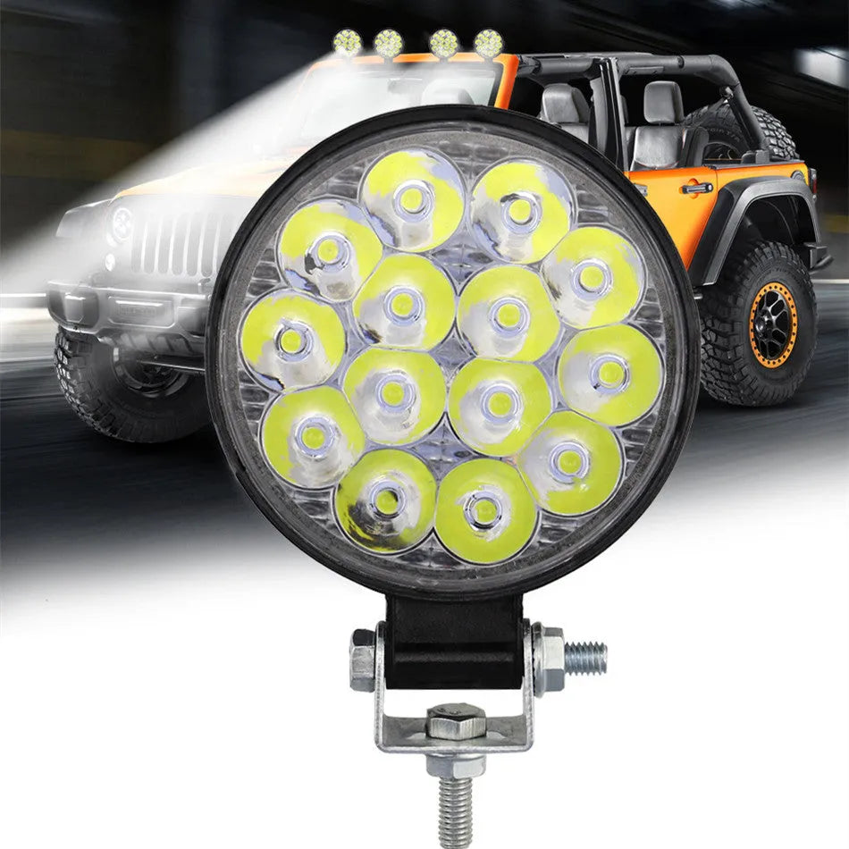 Compact round aluminium car LED work light with IP67 waterproof rating and 6000K white light output.