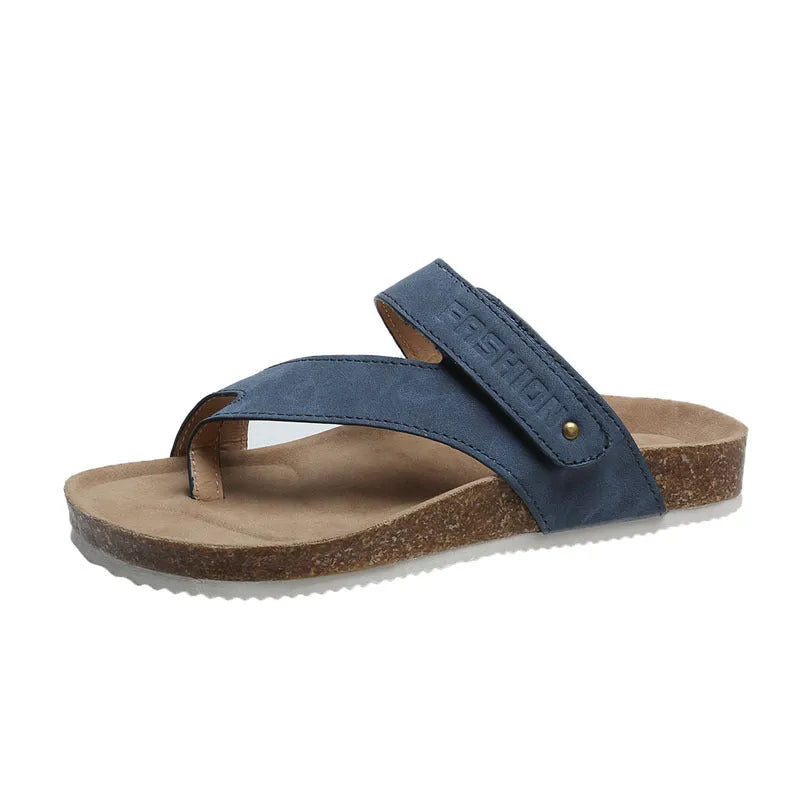 Blue thick-soled flat toe ring flip-flops on a white background.