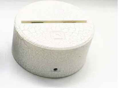 Modern lotus-shaped acrylic night light with touch switch and LED illumination.