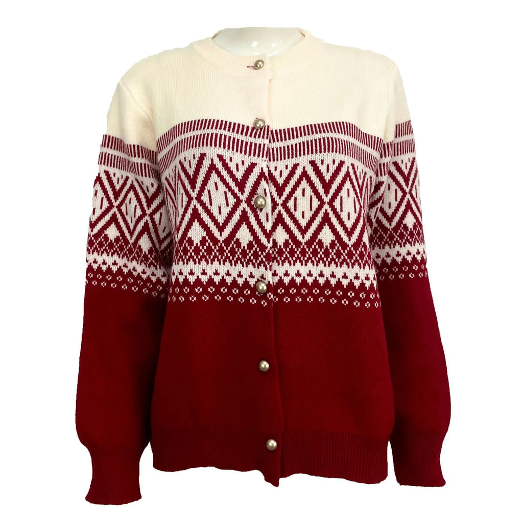 Woman wearing a grey alpaca wool cardigan with a long-sleeve diamond knit pattern in contrasting colours.