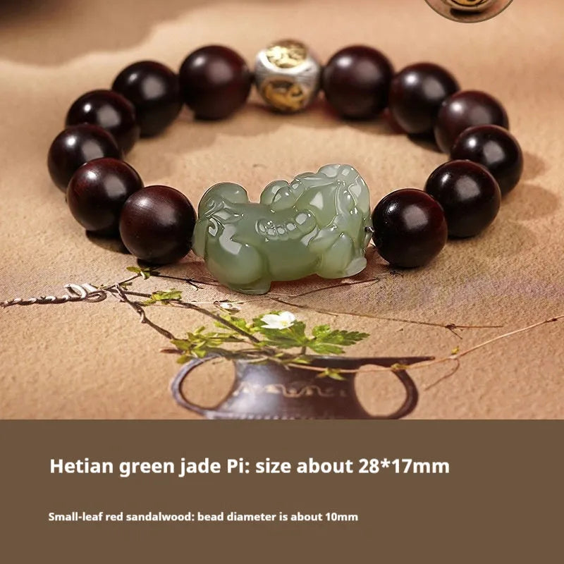 Close-up of a brown and black braided rope bracelet with a central Hetian jade bead on a wrist.