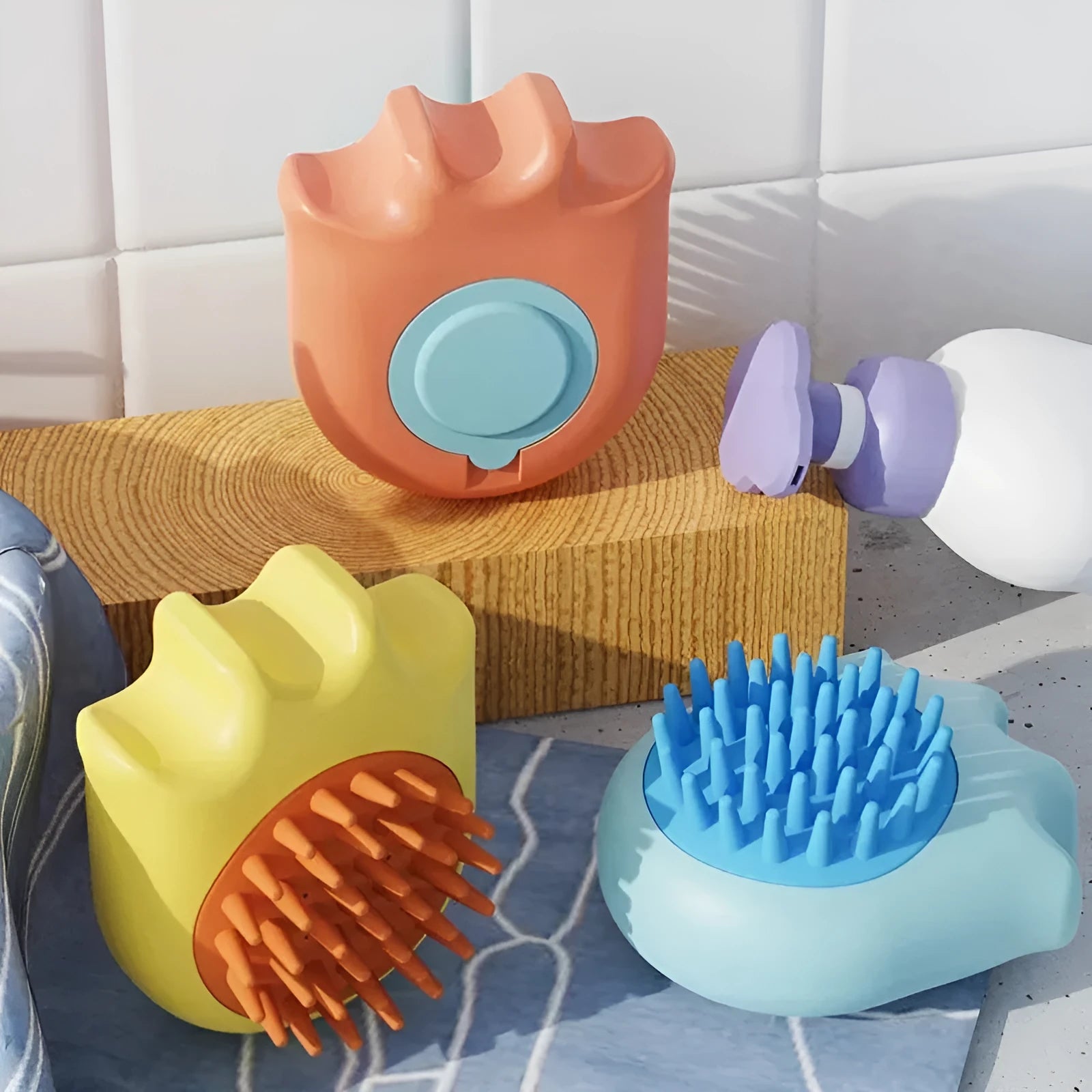 Blue pet bath brush and massage comb for dogs and cats with integrated shampoo box.