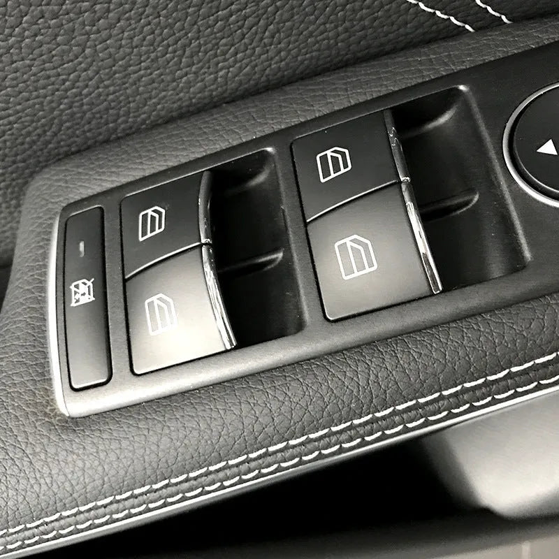 Black ABS plastic decorative sticker for a car window lift button.
