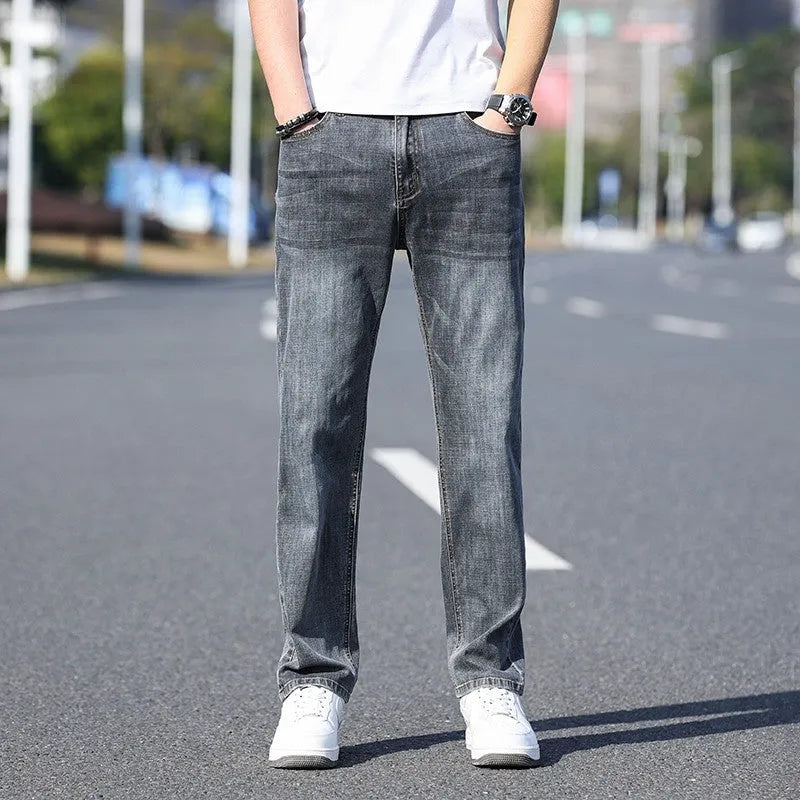 Tapered cotton denim business casual trousers with stretch fabric in light blue, grey, blue-grey and black colours