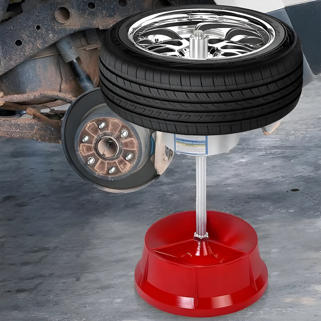 Portable aluminium hub wheel balancer with bull's eye level on a black enamel finished base.