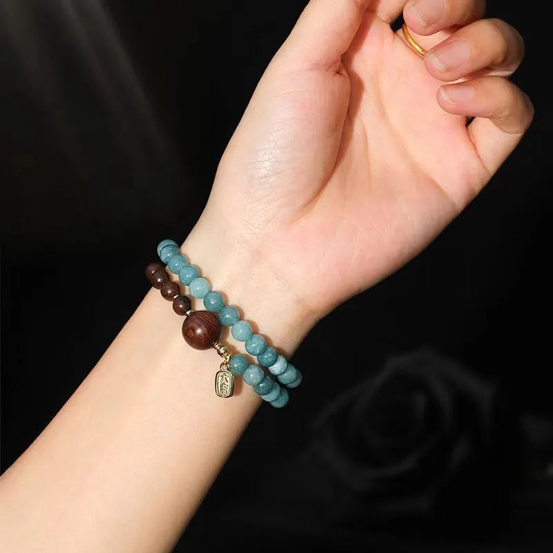 Blue gold sandalwood beaded bracelet for women with geometric design featuring Fu and Xi characters in New Chinese style