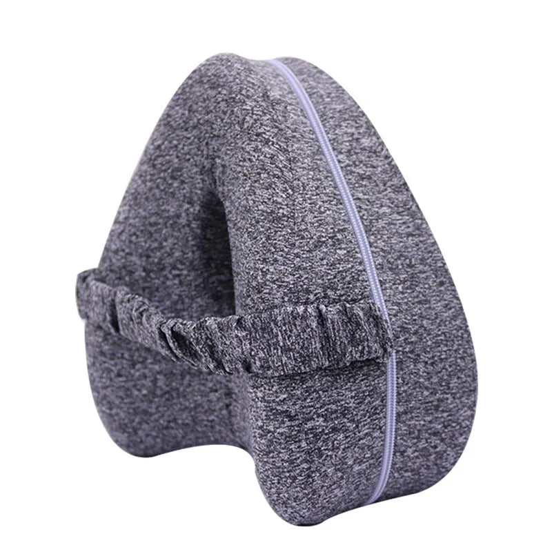 Heart-shaped dark blue memory foam leg pillow for adult use.