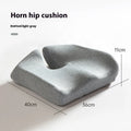 Dark grey memory foam office chair cushion for lumbar support on a desk chair.
