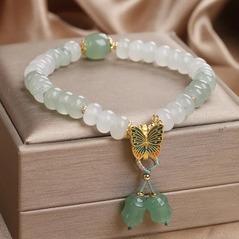 Green Tian Shan Cui abacus bead bracelet with crystal construction and butterfly tassel charms