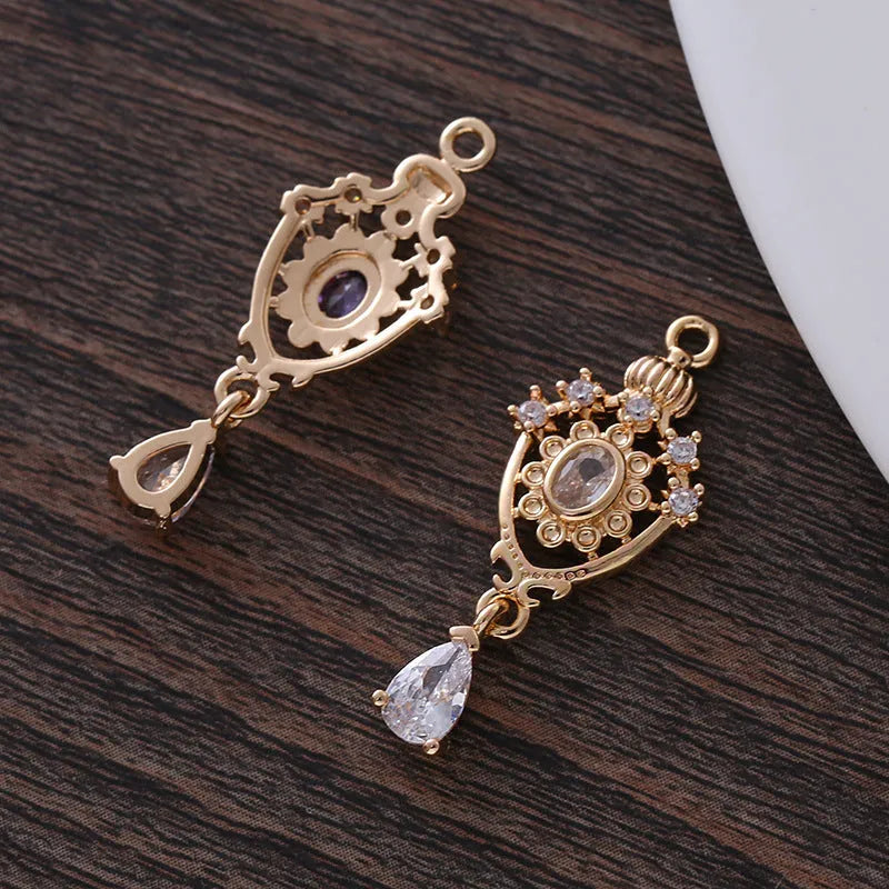 Micro inlaid zircon crown hollow water drop-shaped copper pendant in electroplated colour.