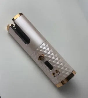 A white portable automatic wireless curling iron with a USB cable and a gold ceramic barrel.