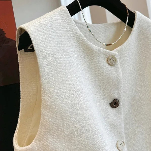 Women's French style round neck bandage vest in polyester fabric, available in milky white and black colours