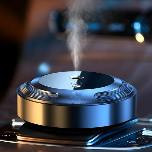 Automatic car air freshener with zinc alloy shell showing three fragrance bottles and charging cable